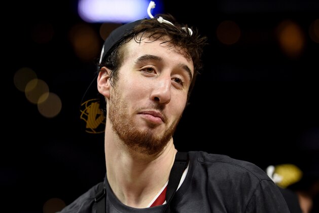 LOS ANGELES, CA - MARCH 28:  Frank Kaminsky #44 of the Wisconsin Badgers smiles after he cuts the net after the Badgers 85-78 victory against the Arizona Wildcats during the West Regional Final of the 2015 NCAA Men's Basketball Tournament at Staples Center on March 28, 2015 in Los Angeles, California.  (Photo by Harry How/Getty Images)