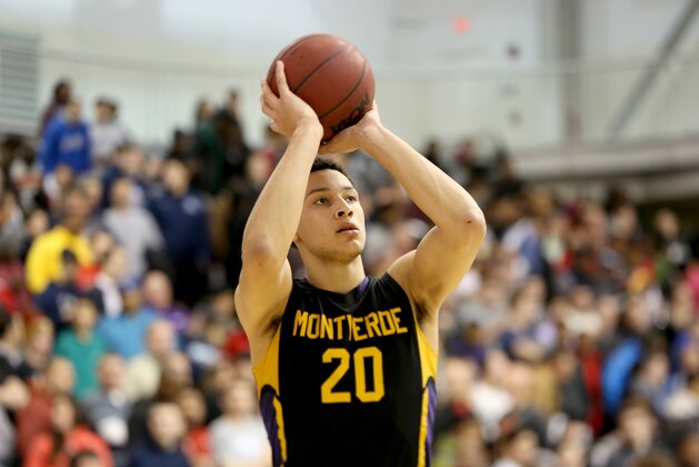 Montverde Academy's Ben Simmons #20 warms up against Roselle Catholic during a high school basketball game on Friday, Feb. 13, 2015, in Kean, NJ.  Montverde won the game. (AP Photo/Gregory Payan)
