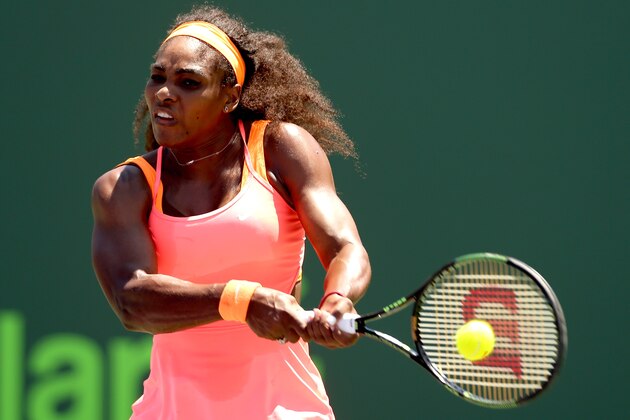 KEY BISCAYNE, FL - APRIL 04:  Serena Williams returns a shot to Carla Suarez Navarro of Spain during the final on day 13 of the Miami Open Presented by Itau at Crandon Park Tennis Center on April 4, 2015 in Key Biscayne, Florida.  (Photo by Matthew Stockman/Getty Images)