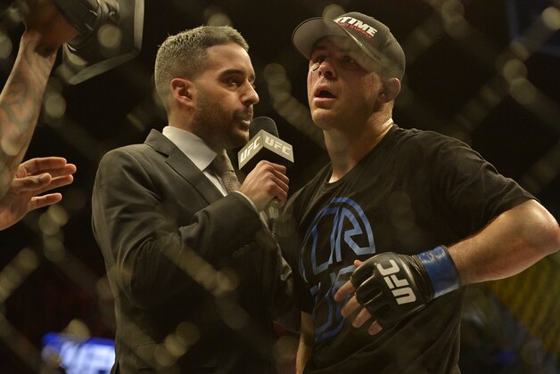Apr 4, 2015; Fairfax, VA, USA; Al Iaquinta (blue gloves) speaks to the media after defeating Jorge Masvidal (not pictured) during UFC Fight Night at Patriot Center. Mandatory Credit: Tommy Gilligan-USA TODAY Sports