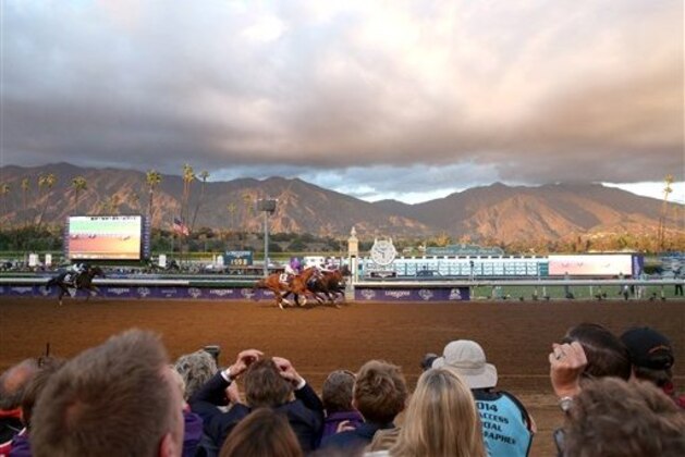 IMAGE DISTRIBUTED FOR BREEDERS’ CUP - Attendees react as Bayern wins the classic at day 2 of the 2014 Breeders' Cup World Championships at Santa Anita Park on Saturday, Nov. 1, 2014, in Arcadia, Calif. (Photo by Matt Sayles/Invision for Breeders' Cup/AP Images)