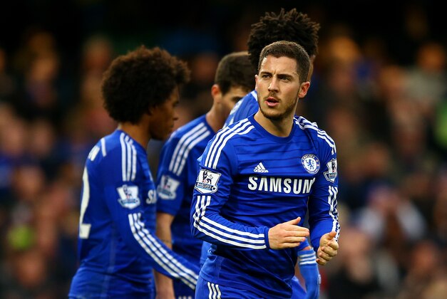LONDON, ENGLAND - APRIL 04:  Eden Hazard of Chelsea celebrates with team-mates after scoring the opening goal from the penalty spot during the Barclays Premier League match between Chelsea and Stoke City at Stamford Bridge on April 4, 2015 in London, England.  (Photo by Richard Heathcote/Getty Images)
