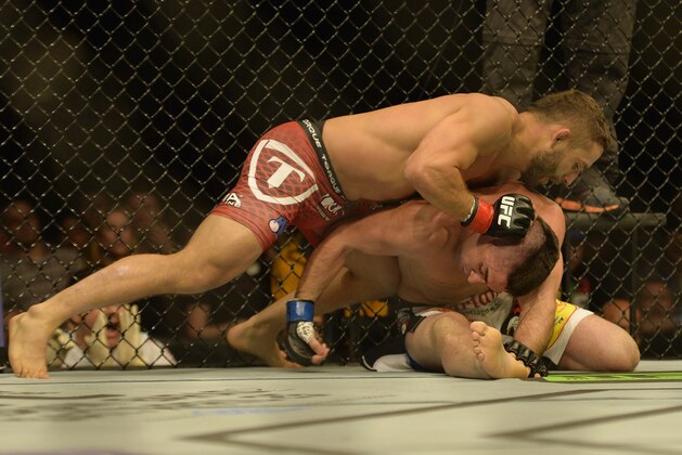 Apr 4, 2015; Fairfax, VA, USA; Chad Mendes (red gloves) fights Richardo Lamas (blue gloves) during UFC Fight Night at Patriot Center. Mandatory Credit: Tommy Gilligan-USA TODAY Sports