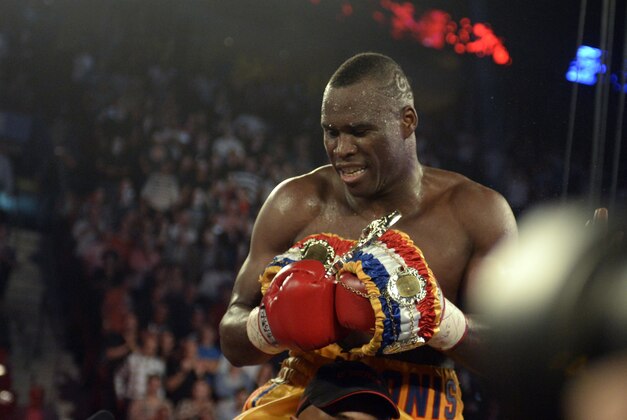 Sep 28, 2013; Montreal, Quebec, Canada;  Adonis Stevenson (yellow trunks) celebrates winning his light-heavyweight WBC world championship bout  against Tavoris Cloud (not pictured) at the Bell Centre. Mandatory Credit: Eric Bolte-USA TODAY Sports