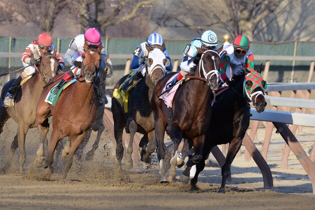 In this photo provided by the New York Racing Association, Verrazano, second from right, with John Velazquez aboard, captures The Grade I Wood Memorial stakes horse race at Aqueduct Race Track in New York, Saturday, April 6, 2013. Normandy Invasion (red helmet) was second and Vyjack (pink helmet) was third. (AP Photo/New York Racing Association)