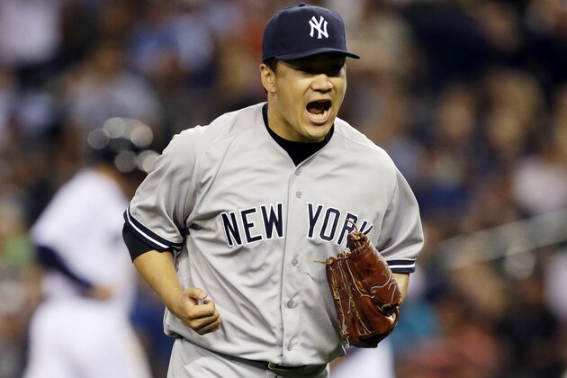 New York Yankees starting pitcher Masahiro Tanaka yells after the eighth inning of a baseball game against the Seattle Mariners ended with a double play, Wednesday, June 11, 2014, in Seattle. Tanaka had a shutout going until the Mariners' Robinson Cano hit a two-run home run in the ninth inning, but Tanaka finished the complete game and the Yankees beat the Mariners 4-2. (AP Photo/Ted S. Warren)
