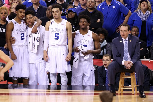 INDIANAPOLIS, IN - APRIL 04:  Quinn Cook #2, Jahlil Okafor #15, Tyus Jones #5 and Justise Winslow #12 of the Duke Blue Devils look on with their head coach Mike Krzyzewski late in the game against the Michigan State Spartans during the NCAA Men's Final Four Semifinal at Lucas Oil Stadium on April 4, 2015 in Indianapolis, Indiana. Duke defeated Michigan State 81-61.  (Photo by Joe Robbins/Getty Images)