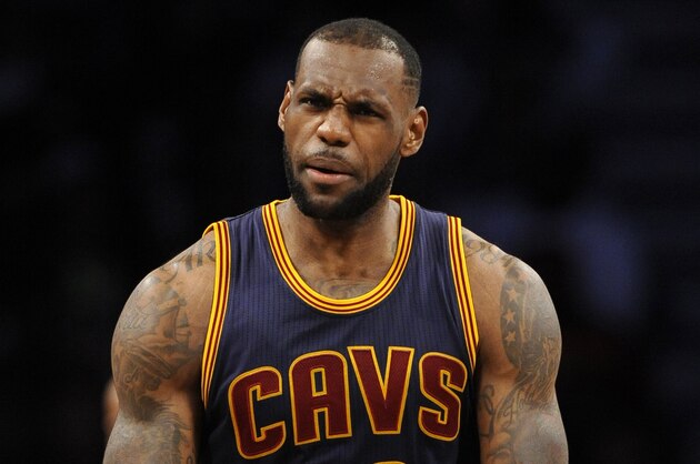Cleveland Cavaliers forward LeBron James (23) reacts to a traveling violation call in the second half of an NBA basketball game against the Brooklyn Nets on Friday, March 27, 2015, in New York. The Nets won 106-98. (AP Photo/Kathy Kmonicek)