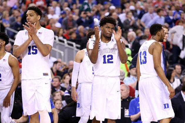 INDIANAPOLIS, IN - APRIL 04: Jahlil Okafor #15 and Justise Winslow #12 of the Duke Blue Devils celebrate after defeating the Michigan State Spartans during the NCAA Men's Final Four Semifinal at Lucas Oil Stadium on April 4, 2015 in Indianapolis, Indiana. Duke defeated Michigan State 81-61. (Photo by Andy Lyons/Getty Images)