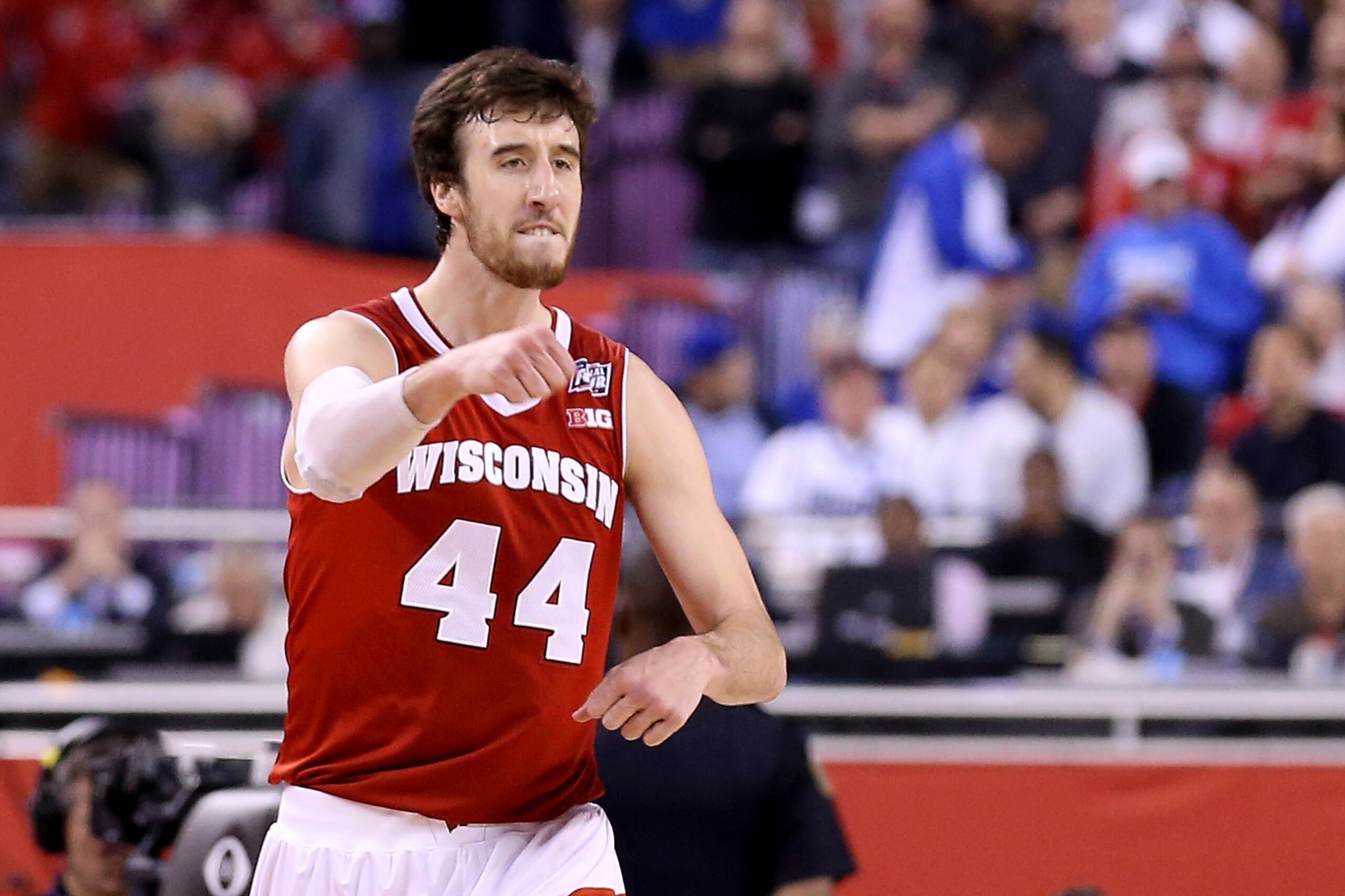 INDIANAPOLIS, IN - APRIL 04:  Frank Kaminsky #44 of the Wisconsin Badgers celebrates late in the game against the Kentucky Wildcats during the NCAA Men's Final Four Semifinal at Lucas Oil Stadium on April 4, 2015 in Indianapolis, Indiana.  (Photo by Streeter Lecka/Getty Images)
