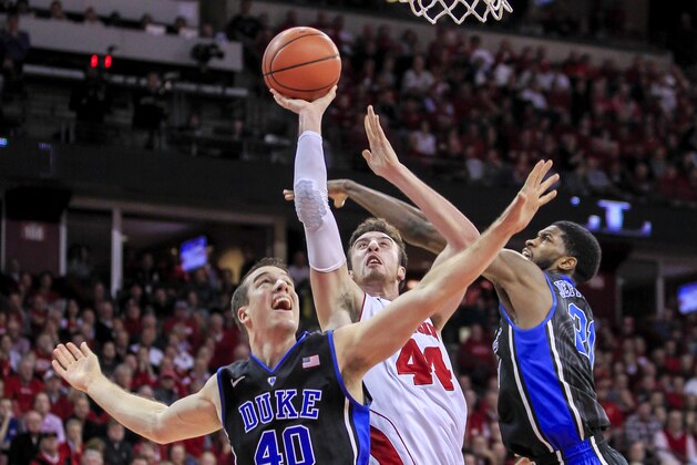 Duke's Marshall Plumlee (40) and Amile Jefferson double team Wisconsin's Frank Kaminsky during the second half of an NCAA college basketball game Wednesday, Dec. 3, 2014, in Madison, Wis. Duke won 80-70. (AP Photo/Andy Manis)
