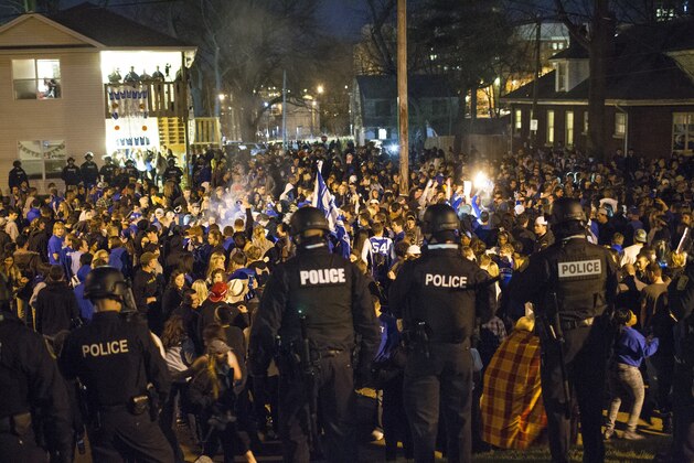 Kentucky fans gather near the University of Kentucky campus, Saturday, April 4, 2015, in Lexington, Ky., after Wisconsin defeated Kentucky 71-64 in the semifinals of the NCAA men's college basketball tournament Final Four in Indianapolis. (AP Photo/David Stephenson)