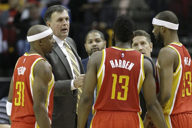 Houston Rockets coach Kevin McHale, second from left, talks with Jason Terry (31), James Harden (13) and Corey Brewer (33) during a timeout in the second half of an NBA basketball game against the Oklahoma City Thunder Thursday, Jan. 15, 2015, in Houston. The Rockets won 112-101. (AP Photo/Pat Sullivan)
