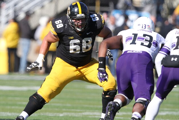 Iowa offensive lineman Brandon Scherff (68) blocks during the second half of an NCAA college football game against Northwestern, Saturday, Nov. 1, 2014, in Iowa City, Iowa. (AP Photo/Justin Hayworth)