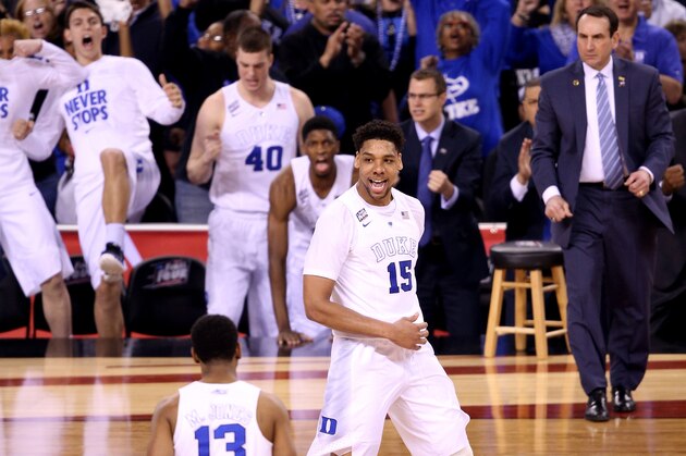 INDIANAPOLIS, IN - APRIL 04:  Jahlil Okafor #15 of the Duke Blue Devils reacts after a play in the second half as Mike Krzyzewski looks on against the Michigan State Spartans during the NCAA Men's Final Four Semifinal at Lucas Oil Stadium on April 4, 2015 in Indianapolis, Indiana.  (Photo by Joe Robbins/Getty Images)