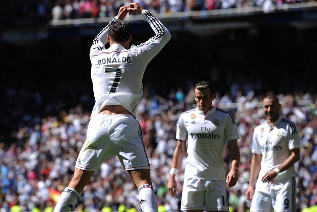 MADRID, SPAIN - APRIL 05:  Cristiano Ronaldo of Real Madrid CF celebrates after scoring his team's 3rd goal during the La Liga match between Real Madrid CF and Granada CF at Estadio Santiago Bernabeu on April 5, 2015 in Madrid, Spain.  (Photo by Denis Doyle/Getty Images)