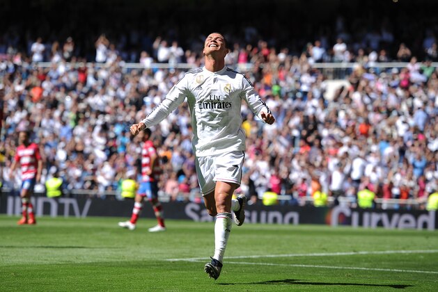 MADRID, SPAIN - APRIL 05:  Cristiano Ronaldo of Real Madrid CF celebrates after scoring his team's 3rd goal during the La Liga match between Real Madrid CF and Granada CF at Estadio Santiago Bernabeu on April 5, 2015 in Madrid, Spain.  (Photo by Denis Doyle/Getty Images)