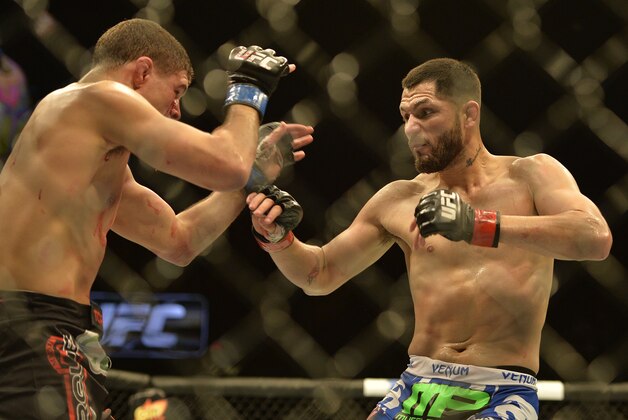 Apr 4, 2015; Fairfax, VA, USA; Jorge Masvidal (red gloves) fights Al Iaquinta (blue gloves) during UFC Fight Night at Patriot Center. Mandatory Credit: Tommy Gilligan-USA TODAY Sports