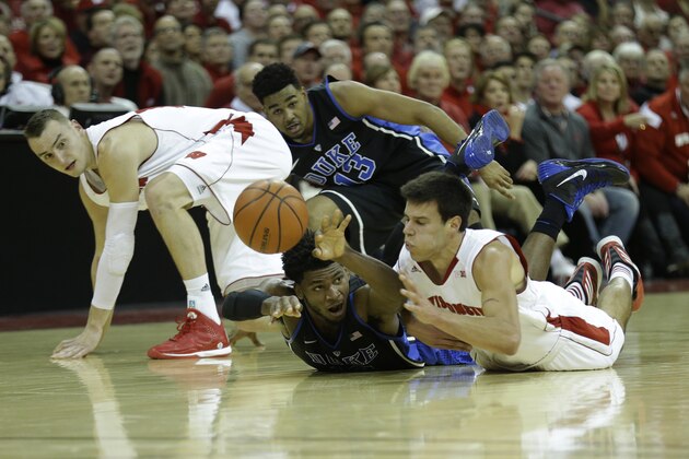MADISON, WI - DECEMBER 03: Justise Winslow #12 of the Duke Blue Devils fights Duje Dukan #13 of the Wisconsin Badgers for a loose ball during the first half at Kohl Center on December 03, 2014 in Madison, Wisconsin. (Photo by Mike McGinnis/Getty Images)