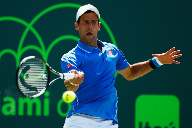 KEY BISCAYNE, FL - APRIL 05:  Novak Djokovic of Serbia returns the ball against  Andy Murray of Great Britain  during the Men's final match on day 14 of the Miami Open at Crandon Park Tennis Center on April 5, 2015 in Key Biscayne, Florida.  (Photo by Al Bello/Getty Images)