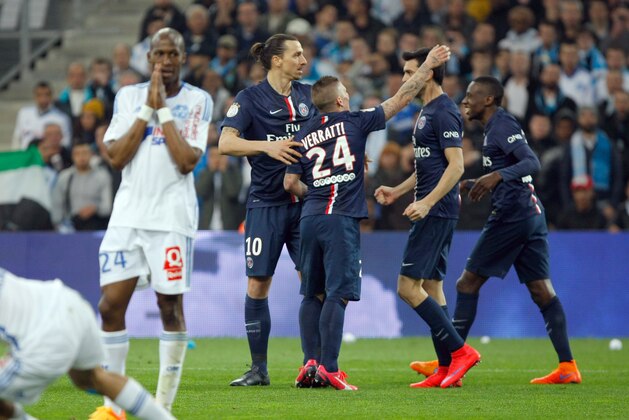 Paris Saint Germain's Brazilian defender Marquinhos, second right, celebrates scoring with teammates Marco Verrati, Zlatan Ibrahimovic, left, and Blaise Matuidi, right, during the League One soccer match between Marseille and Paris Saint-Germain, at the Velodrome Stadium, in Marseille, southern France, Sunday, April 5, 2015. (AP Photo/Claude Paris)