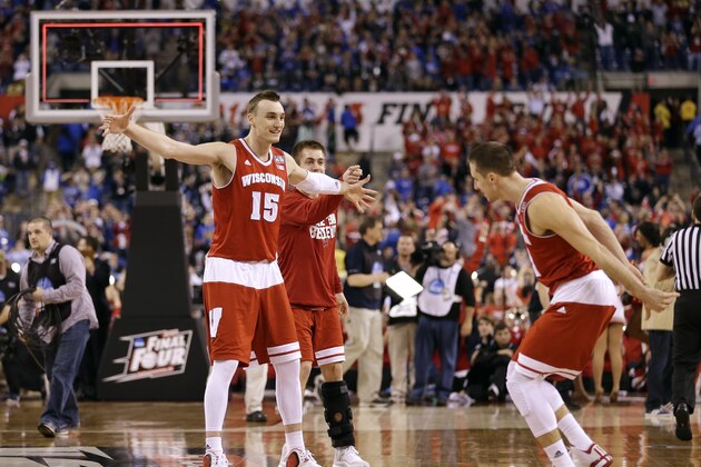 Wisconsin's Sam Dekker, left, celebrates with teammate Josh Gasser, right, after an NCAA Final Four tournament college basketball semifinal game against Kentucky Saturday, April 4, 2015, in Indianapolis. Wisconsin won 71-64. (AP Photo/David J. Phillip)