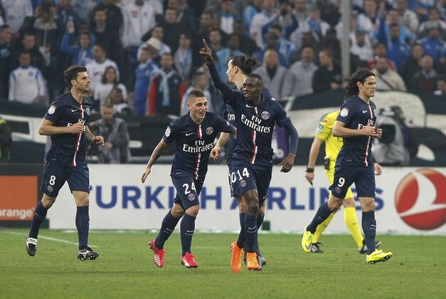 Paris Saint Germain's French midfielder Blaise Matuidi celebrates scoring against Marseille, during the League One soccer match between Marseille and Paris Saint-Germain, at the Velodrome Stadium, in Marseille, southern France, Sunday, April 5, 2015. (AP Photo/Claude Paris)