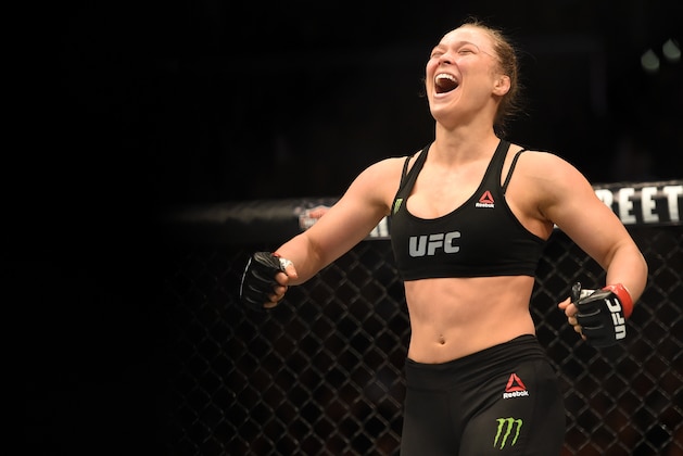 LOS ANGELES, CA - FEBRUARY 28:  Ronda Rousey celebrates her victory over Cat Zingano in their UFC women's bantamweight championship bout during the UFC 184 event at Staples Center on February 28, 2015 in Los Angeles, California.  (Photo by Harry How/Getty Images)
