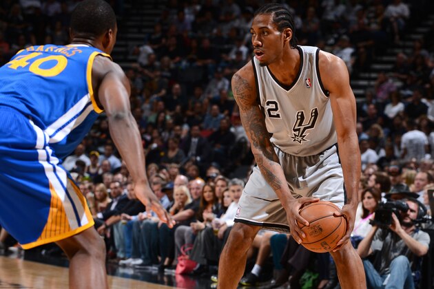 SAN ANTONIO, TX - MAY 14: Kawhi Leonard #2 of the San Antonio Spurs controls the ball against Harrison Barnes #40 of the Golden State Warriors in Game Five of the Western Conference Semifinals during the 2013 NBA Playoffs on May 14, 2013 at the AT&T Center in San Antonio, Texas. NOTE TO USER: User expressly acknowledges and agrees that, by downloading and/or using this Photograph, user is consenting to the terms and conditions of the Getty Images License Agreement. Mandatory Copyright Notice: Copyright 2013 NBAE (Photo by Garrett W. Ellwood/NBAE via Getty Images)