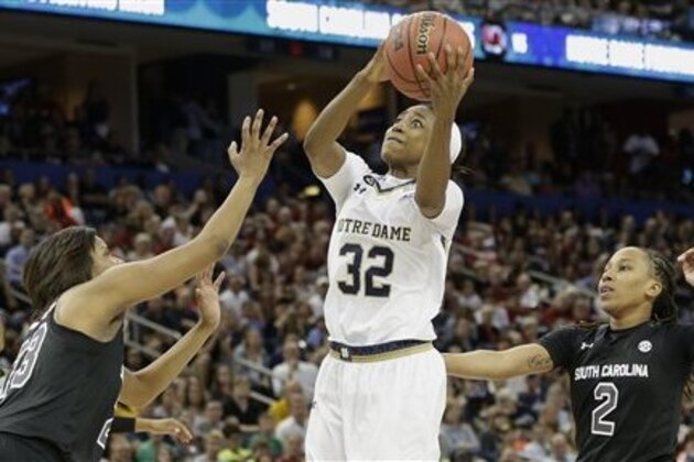 Notre Dame guard Jewell Loyd (32) shoots against South Carolina guard Tina Roy (23) during the second half of the NCAA Women's Final Four tournament college basketball semifinal game, Sunday, April 5, 2015, in Tampa, Fla. (AP Photo/Brynn Anderson)