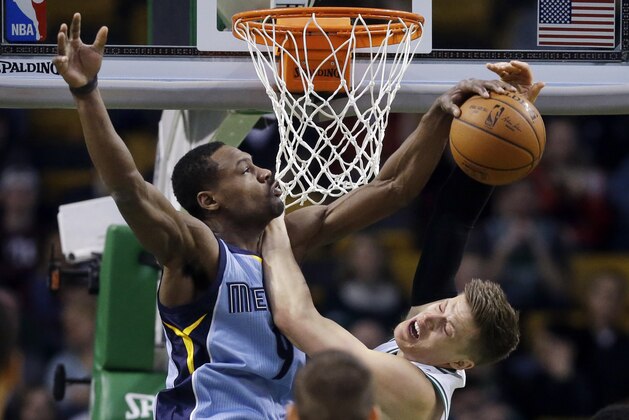 Memphis Grizzlies forward Tony Allen, left, blocks the shot of Boston Celtics forward Jonas Jerebko during the first half of an NBA basketball game in Boston, Wednesday, March 11, 2015. (AP Photo/Elise Amendola)