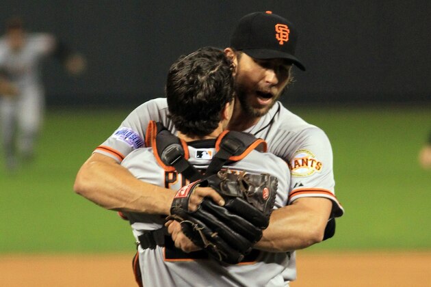 KANSAS CITY, MO - OCTOBER 29:  Buster Posey #28 and Madison Bumgarner #40 of the San Francisco Giants celebrate after defeating the Kansas City Royals to win Game Seven of the 2014 World Series by a score of 3-2 at Kauffman Stadium on October 29, 2014 in Kansas City, Missouri.  (Photo by Alex Trautwig/Getty Images)