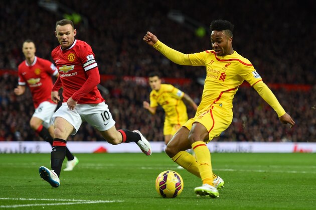 MANCHESTER, ENGLAND - DECEMBER 14:  Raheem Sterling of Liverpool attacks under pressure from Wayne Rooney of Manchester United during the Barclays Premier League match between Manchester United and Liverpool at Old Trafford on December 14, 2014 in Manchester, England.  (Photo by Shaun Botterill/Getty Images)