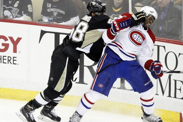 Pittsburgh Penguins' Kris Letang (58) checks Montreal Canadiens' P.K. Subban (76) during the third period of an NHL hockey game in Pittsburgh Saturday, Jan. 3, 2015.(AP Photo/Tom E. Puskar)