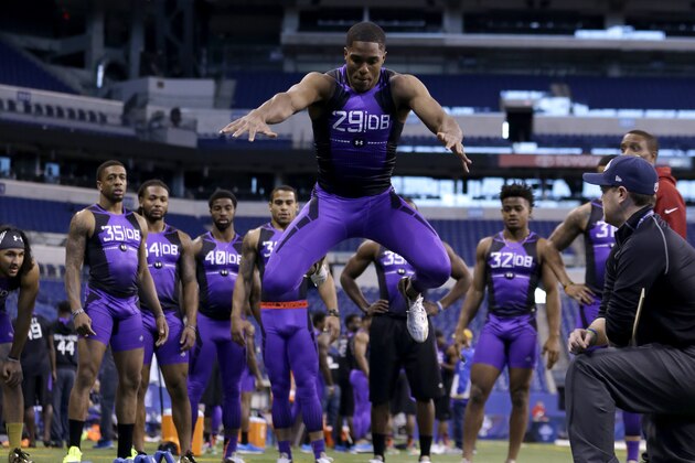 Connecticut defensive back Byron Jones runs a drill on the broad jump station at the NFL football scouting combine in Indianapolis, Monday, Feb. 23, 2015. Jones soared 12 feet, 3 inches in the broad jump, which was 15 inches farther than the second-best defensive back and 8 inches longer than the best listed in the NFL scouting combine database. (AP Photo/Julio Cortez)