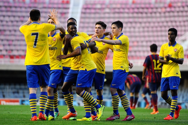 BARCELONA, SPAIN - MARCH 18:  Arsenal players celebrate after Serge Gnabry scored his team's first goal during the UEFA Youth League Quarter FInal match between FC Barcelona U19 and Arsenal U19 at Mini Estadi on March 18, 2014 in Barcelona, Spain.  (Photo by David Ramos/Getty Images)