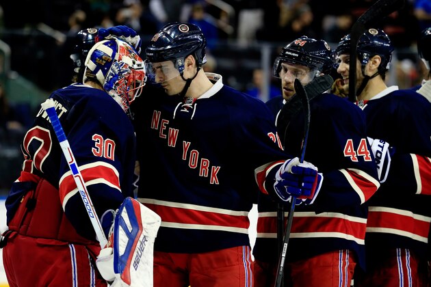 NEW YORK, NY - APRIL 04: Henrik Lundqvist #30 and Chris Kreider #20 of the New York Rangers celebrate after defeating the New Jersey Devils 6-1 during a game at Madison Square Garden on April 4, 2015 in New York City.  (Photo by Alex Trautwig/Getty Images)