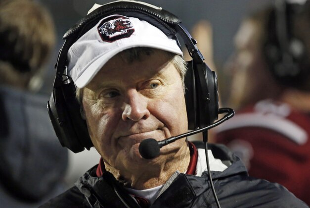 South Carolina football coach Steve Spurrier looks away from play against Miami in the second half of the Independence Bowl NCAA college football game in Shreveport, La., Saturday, Dec. 27, 2014. South Carolina won 24-21. (AP Photo/Rogelio V. Solis)