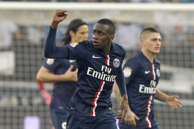 Paris Saint Germain's French midfielder Blaise Matuidi celebrates scoring against Marseille, during the League One soccer match between Marseille and Paris Saint-Germain, at the Velodrome Stadium, in Marseille, southern France, Sunday, April 5, 2015. (AP Photo/Claude Paris)