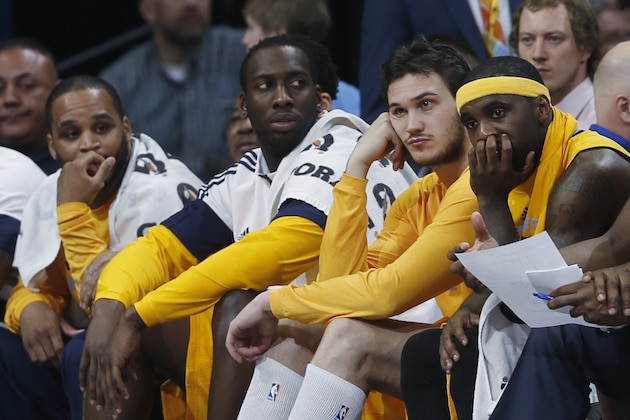 From front, Denver Nuggets guard Ty Lawson, forward Danilo Gallinari, forward J.J. Hickson and guard Jameer Nelson watch from the bench during the fourth quarter of the Nuggets' NBA basketball game against the Utah Jazz on Friday, Feb. 27, 2015, in Denver. Utah won 104-82. (AP Photo/David Zalubowski)