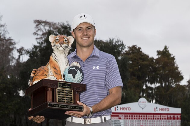 Jordan Spieth holds the championship trophy after winning the Hero World Challenge golf tournament on Sunday, Dec. 7, 2014, in Windermere, Fla. (AP Photo/Willie J. Allen Jr.)