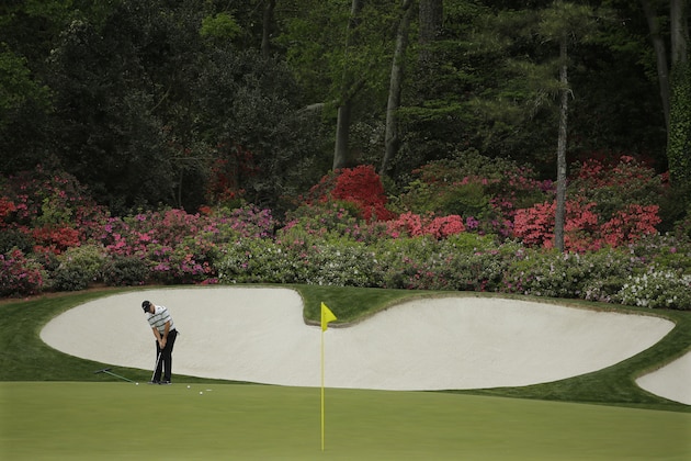 Rory McIlroy, of Northern Ireland,  putts on the 13th green during a practice round for the Masters golf tournament Monday, April 6, 2015, in Augusta, Ga. (AP Photo/Matt Slocum)
