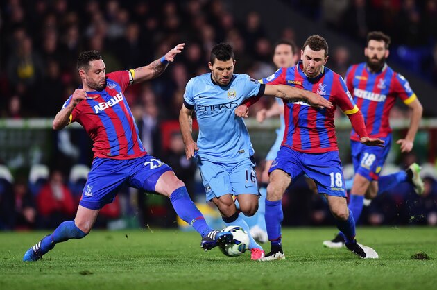 LONDON, ENGLAND - APRIL 06: Sergio Aguero of Manchester City is tackled by Damien Delaney (L) and James McArthur of Crystal Palace during the Barclays Premier League match between Crystal Palace and Manchester City at Selhurst Park on April 6, 2015 in London, England.  (Photo by Jamie McDonald/Getty Images)