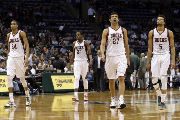 Milwaukee Bucks' Jared Dudley (9), Giannis Antetokounmpo (34), Khris Middleton (22), Zaza Pachulia (27), and Michael Carter-Williams (5) walk onto the court during an NBA basketball game against the Orlando Magic Wednesday, March 11, 2015, in Milwaukee. (AP Photo/Aaron Gash)