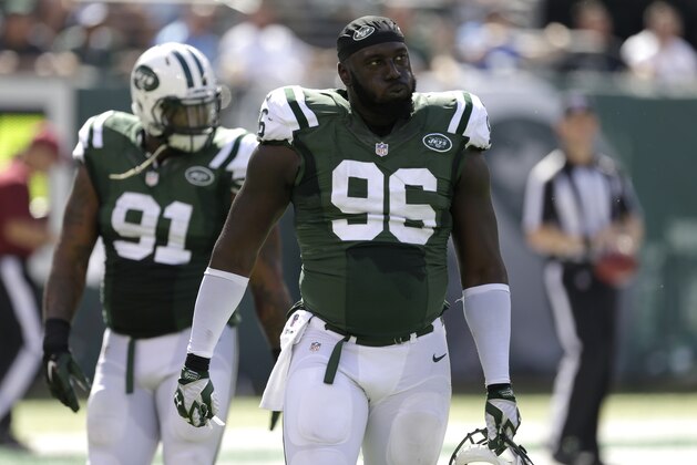 New York Jets defensive end Muhammad Wilkerson walks back to the bench after the Jets allowed a Detroit Lions touchdown during the first half of an NFL football game, Sunday, Sept. 28, 2014, in East Rutherford, N.J. (AP Photo/Frank Franklin II)