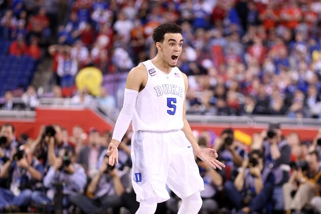 INDIANAPOLIS, IN - APRIL 06: Tyus Jones #5 of the Duke Blue Devils reacts after a three point basket late in the second half against the Wisconsin Badgers during the NCAA Men's Final Four National Championship at Lucas Oil Stadium on April 6, 2015 in Indianapolis, Indiana.  (Photo by Andy Lyons/Getty Images)