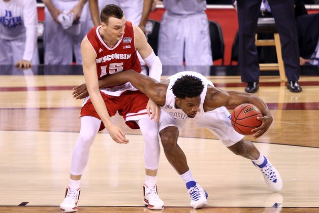 INDIANAPOLIS, IN - APRIL 06: Justise Winslow #12 of the Duke Blue Devils handles the ball against Sam Dekker #15 of the Wisconsin Badgers in the first half during the NCAA Men's Final Four National Championship at Lucas Oil Stadium on April 6, 2015 in Indianapolis, Indiana.  (Photo by Joe Robbins/Getty Images)