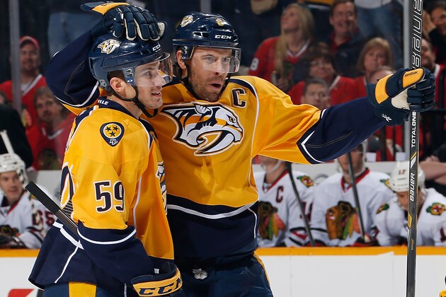 NASHVILLE, TN - DECEMBER 17: Shea Weber #6 celebrates a goal with Roman Josi #59 of the Nashville Predators against the Chicago Blackhawks at Bridgestone Arena on December 17, 2013 in Nashville, Tennessee. (Photo by John Russell/NHLI via Getty Images)