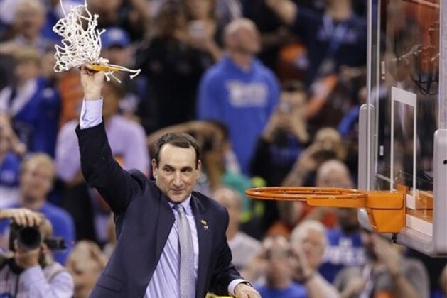 Duke head coach Mike Krzyzewski cuts down the net after his team's 68-63 victory over Wisconsin in the NCAA Final Four college basketball tournament championship game Monday, April 6, 2015, in Indianapolis. (AP Photo/Darron Cummings)