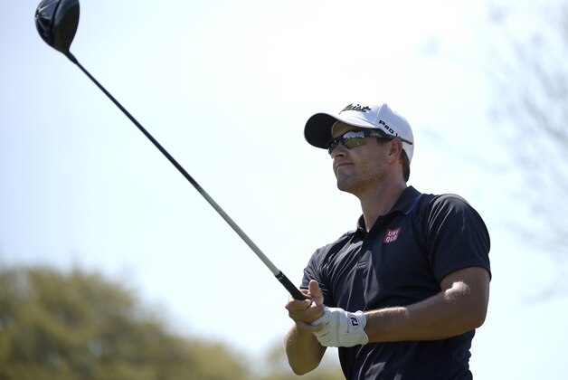 Adam Scott, of Australia, watches his tee shot on the 10th hole during the third round of the Arnold Palmer Invitational golf tournament in Orlando, Fla., Saturday, March 21, 2015.(AP Photo/Phelan M. Ebenhack)